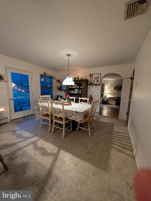 61 Perry Rd, Woodbine, NJ 08270 - dining space with arched walkways, visible vents, and an inviting chandelier