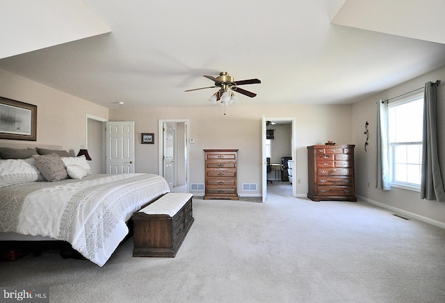 bedroom featuring baseboards, visible vents, and carpet floors