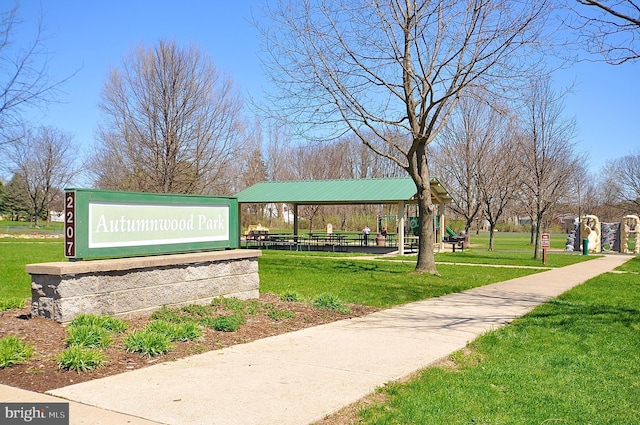 view of property's community featuring a yard and playground community