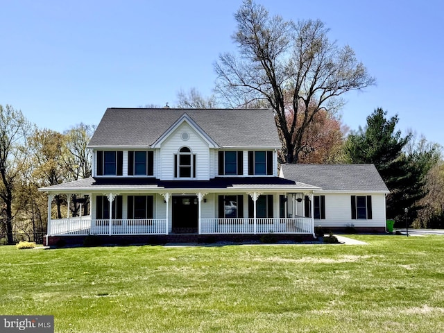 view of front of property featuring covered porch and a front lawn