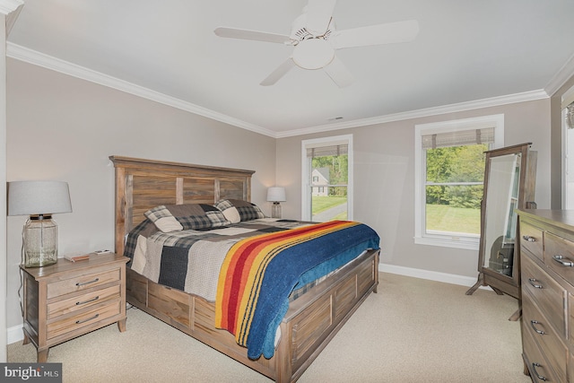 bedroom with baseboards, a ceiling fan, crown molding, and light carpet