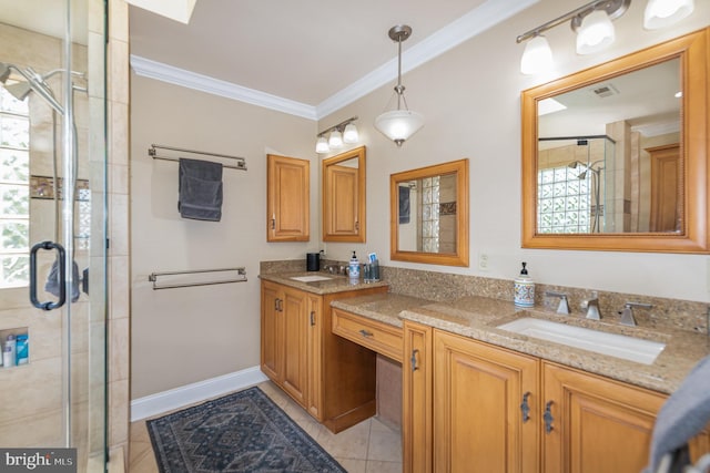full bathroom with a sink, ornamental molding, a shower stall, and visible vents