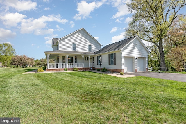 country-style home featuring a shingled roof, an attached garage, a porch, a front yard, and driveway