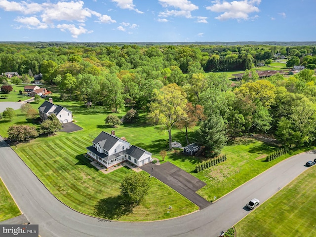 aerial view featuring a wooded view