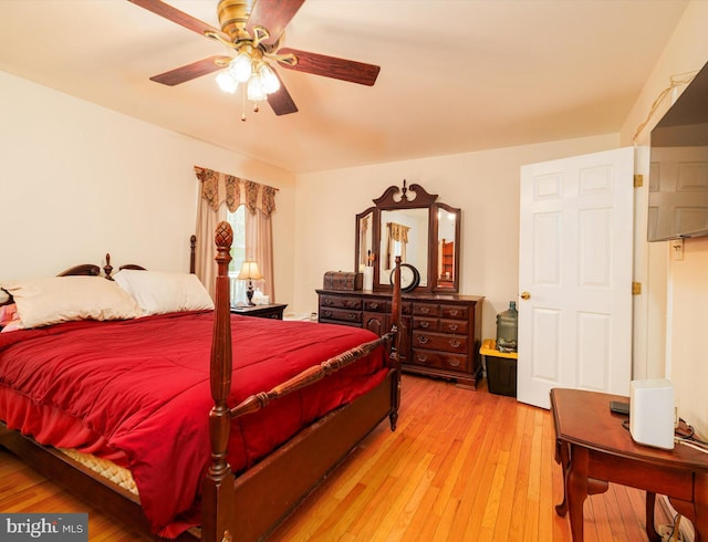bedroom with light wood-style floors and ceiling fan