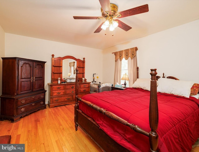 bedroom featuring light wood-style flooring and ceiling fan