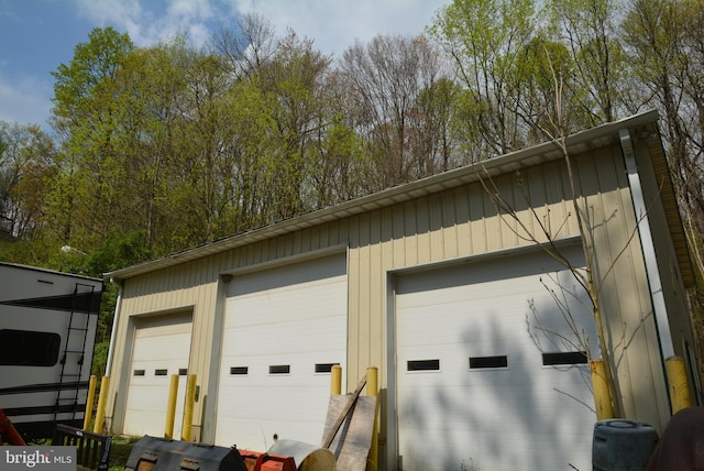 detached garage featuring central AC unit