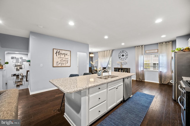 131 Time Cir, Bear, DE 19701 - kitchen with a sink, stainless steel appliances, a center island with sink, white cabinetry, and recessed lighting