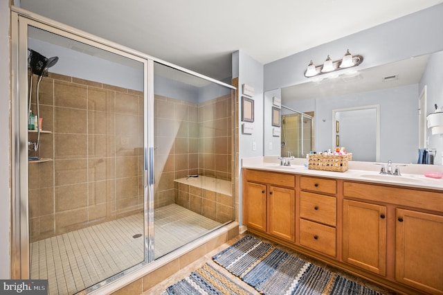 131 Time Cir, Bear, DE 19701 - bathroom with tile patterned floors, a sink, a shower stall, and double vanity