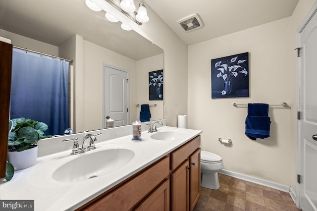 131 Time Cir, Bear, DE 19701 - bathroom featuring baseboards, a sink, visible vents, and double vanity