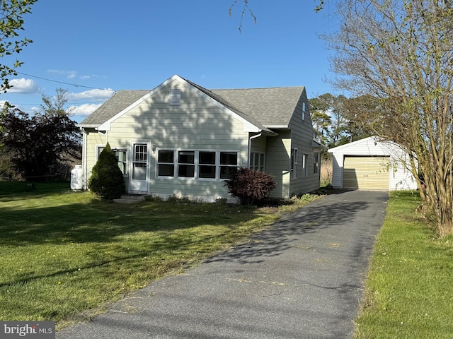4747 Tyaskin Rd, Tyaskin, MD 21865 - view of front facade with a detached garage, aphalt driveway, an outbuilding, entry steps, and a front yard