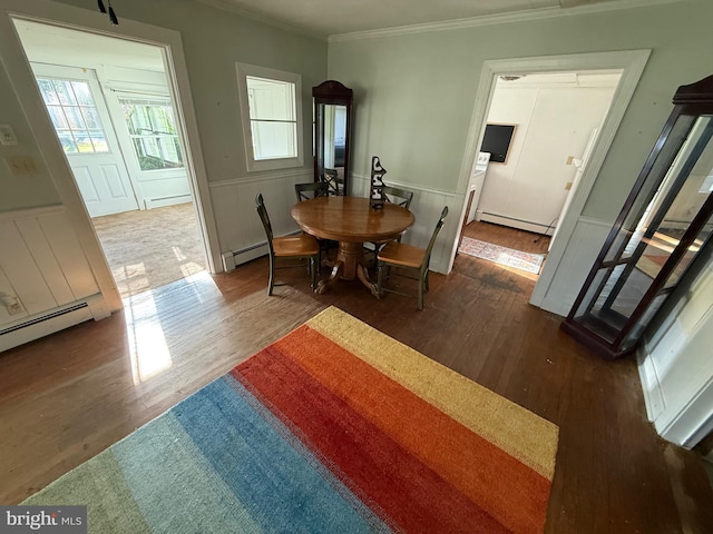 4747 Tyaskin Rd, Tyaskin, MD 21865 - dining area with baseboard heating, crown molding, wainscoting, and wood finished floors