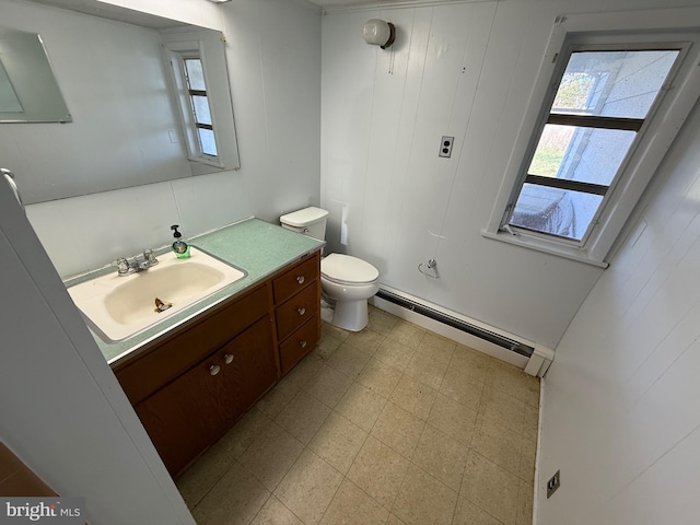 4747 Tyaskin Rd, Tyaskin, MD 21865 - half bath with tile patterned floors, vanity, a baseboard radiator, and toilet