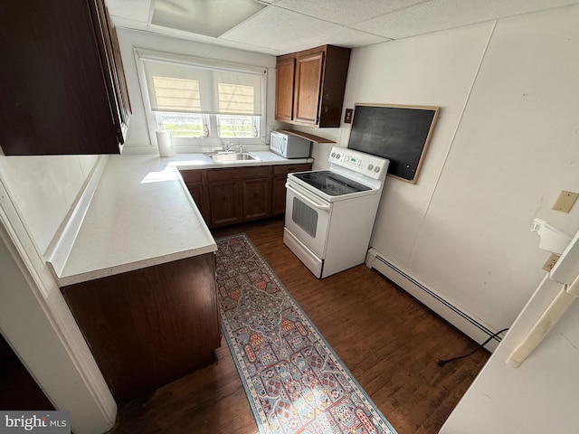 4747 Tyaskin Rd, Tyaskin, MD 21865 - kitchen with baseboard heating, a sink, white appliances, light countertops, and dark wood-type flooring