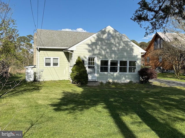 4747 Tyaskin Rd, Tyaskin, MD 21865 - rear view of property featuring a lawn and roof with shingles