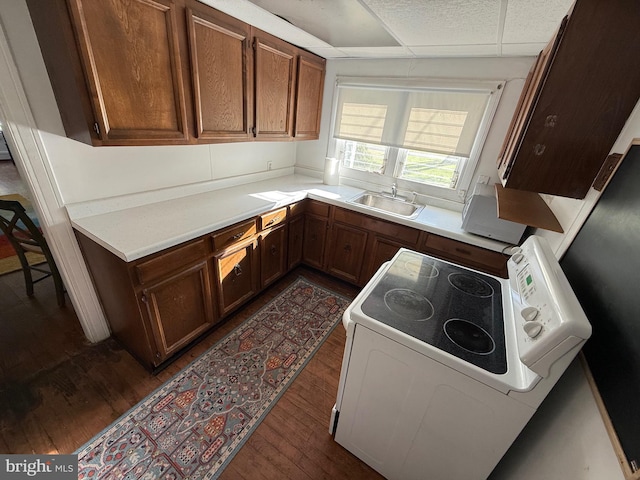 4747 Tyaskin Rd, Tyaskin, MD 21865 - kitchen featuring light countertops, a sink, dark wood-style flooring, and white range with electric stovetop