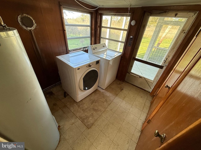 4747 Tyaskin Rd, Tyaskin, MD 21865 - laundry area with washing machine and clothes dryer, wooden walls, laundry area, and a healthy amount of sunlight