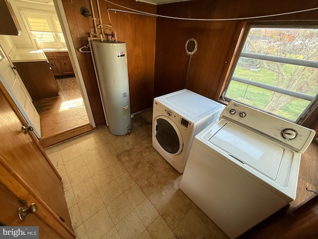 4747 Tyaskin Rd, Tyaskin, MD 21865 - washroom with wooden walls, water heater, independent washer and dryer, and laundry area