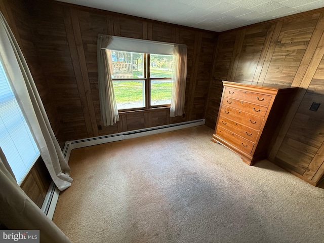 4747 Tyaskin Rd, Tyaskin, MD 21865 - spare room featuring baseboard heating, carpet flooring, and wooden walls