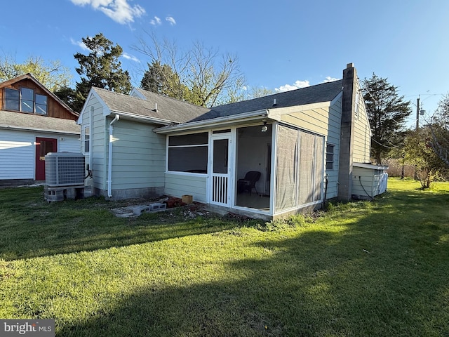 4747 Tyaskin Rd, Tyaskin, MD 21865 - rear view of property featuring central AC, a sunroom, a chimney, and a lawn