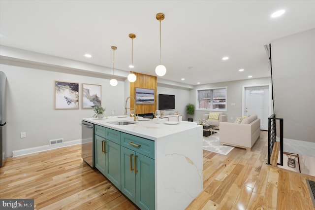 kitchen with recessed lighting, dishwasher, visible vents, a sink, and green cabinets