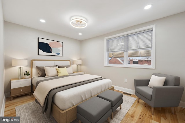 bedroom featuring recessed lighting, light wood-style flooring, visible vents, and baseboards