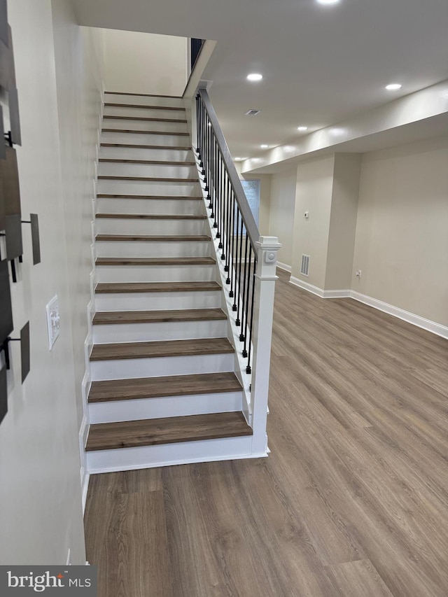 2452 Shirley Ave, Baltimore, MD 21215 - staircase featuring baseboards, recessed lighting, wood finished floors, and visible vents