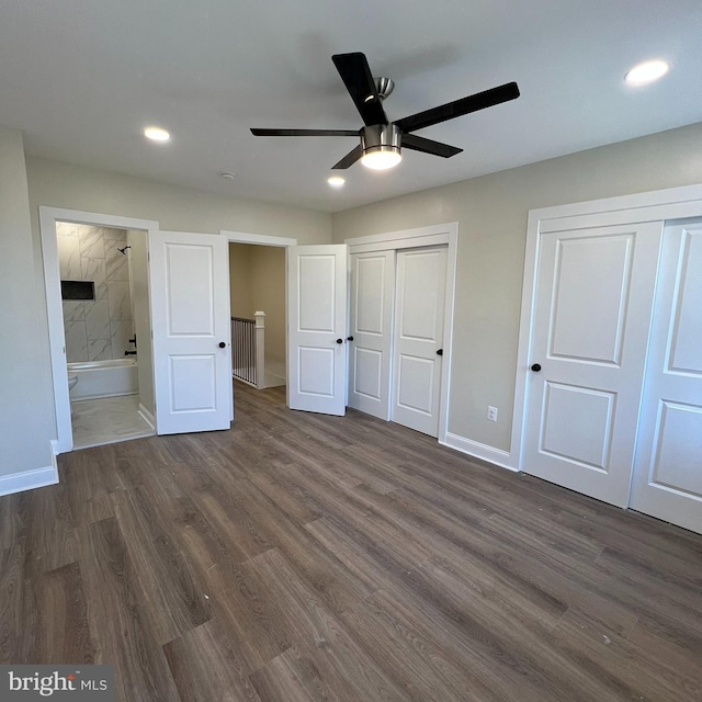 2452 Shirley Ave, Baltimore, MD 21215 - unfurnished bedroom with dark wood-style floors, baseboards, multiple closets, and recessed lighting