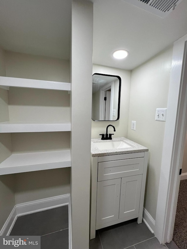 2452 Shirley Ave, Baltimore, MD 21215 - bathroom with vanity, visible vents, tile patterned floors, and baseboards