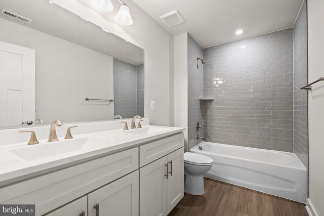 109 Hillsdale Dr, Fredericksburg, VA 22405 - bathroom featuring wood finished floors, double vanity, and shower / bathtub combination