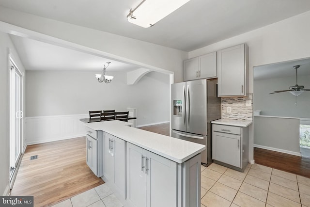 1258 Magnolia, Herndon, VA 20170 - kitchen with stainless steel fridge with ice dispenser, gray cabinetry, light countertops, light tile patterned floors, and a wainscoted wall