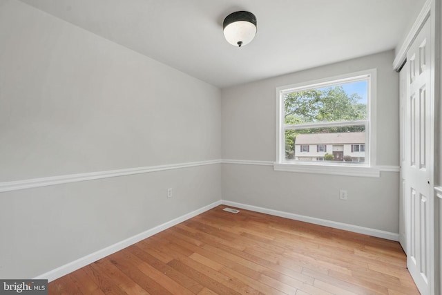 1258 Magnolia, Herndon, VA 20170 - unfurnished bedroom with light wood-style flooring, baseboards, and a closet