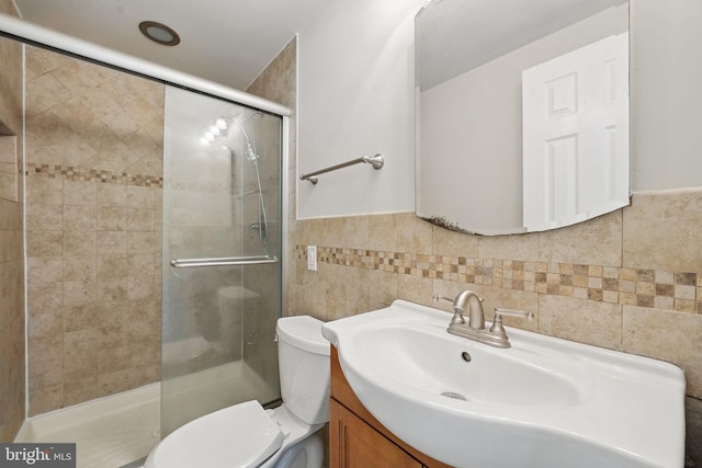 1258 Magnolia, Herndon, VA 20170 - full bath featuring toilet, vanity, a stall shower, tile walls, and a wainscoted wall