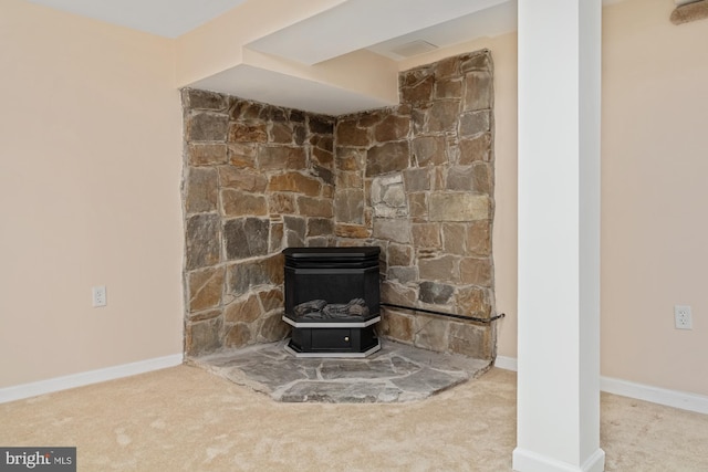 4 Cavan Dr, Lutherville Timonium, MD 21093 - interior details featuring a wood stove, baseboards, and carpet flooring