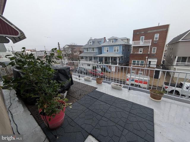 view of patio / terrace with a residential view and a balcony