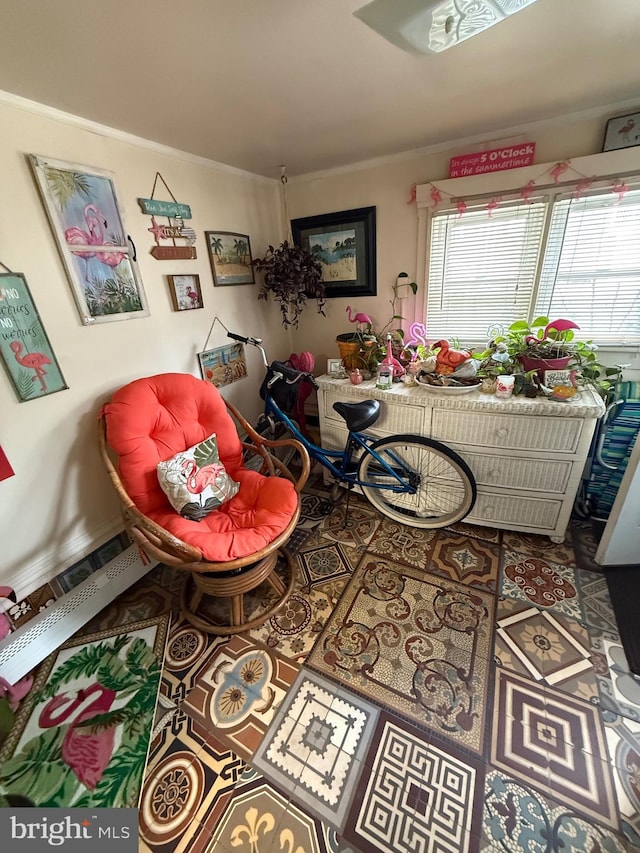dining room with baseboards and crown molding