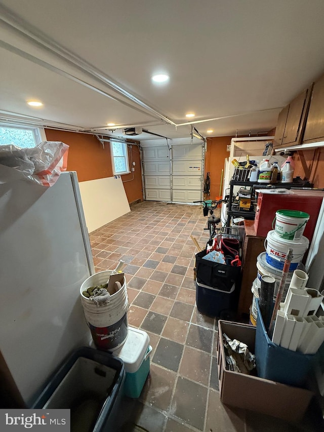garage featuring recessed lighting and a garage door opener