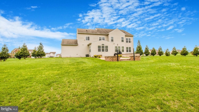 13002 Walkers Ln, Bowie, MD 20721 - rear view of house with a yard and central AC