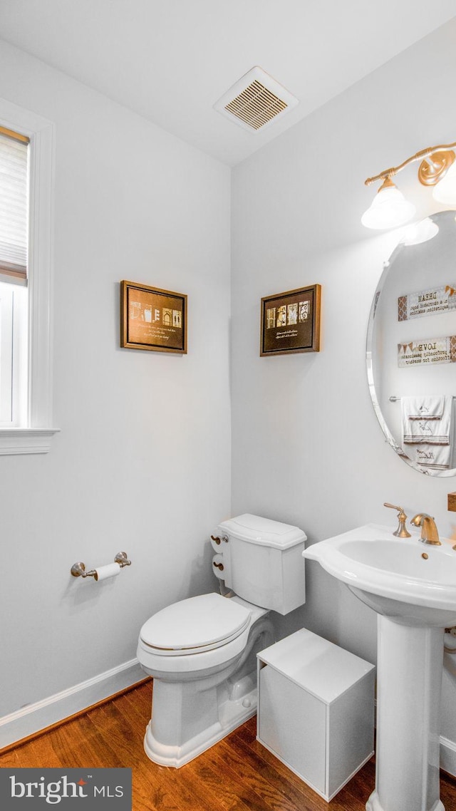 13002 Walkers Ln, Bowie, MD 20721 - half bathroom with visible vents, wood finished floors, and toilet