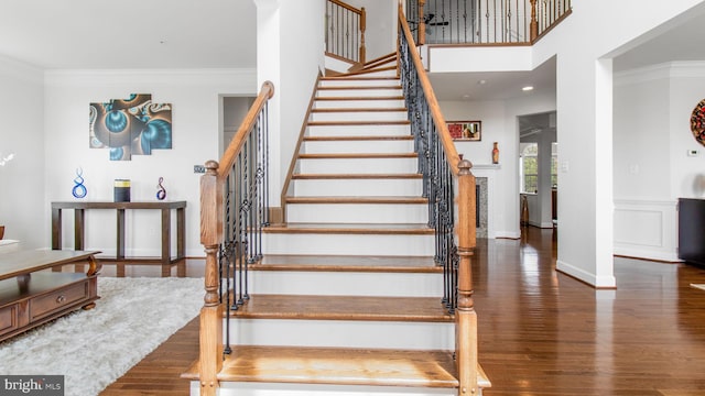 13002 Walkers Ln, Bowie, MD 20721 - stairs with crown molding, baseboards, and wood finished floors