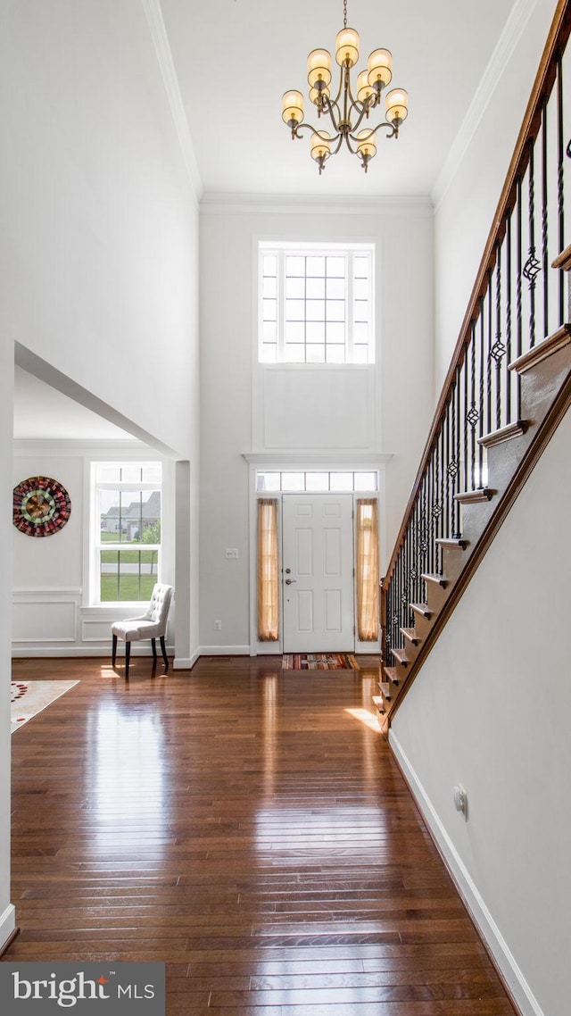 13002 Walkers Ln, Bowie, MD 20721 - foyer entrance featuring a high ceiling, a notable chandelier, hardwood / wood-style floors, ornamental molding, and stairway