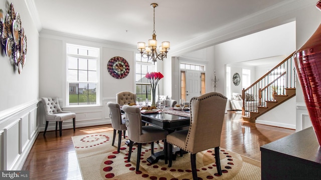 13002 Walkers Ln, Bowie, MD 20721 - dining space with a healthy amount of sunlight, crown molding, wood finished floors, and a notable chandelier