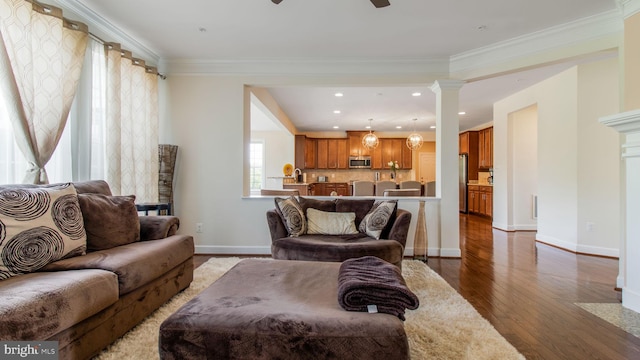 13002 Walkers Ln, Bowie, MD 20721 - living area with ceiling fan, crown molding, baseboards, ornate columns, and hardwood / wood-style floors