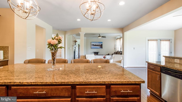 13002 Walkers Ln, Bowie, MD 20721 - kitchen featuring a kitchen island, stainless steel dishwasher, light stone countertops, dark wood finished floors, and recessed lighting