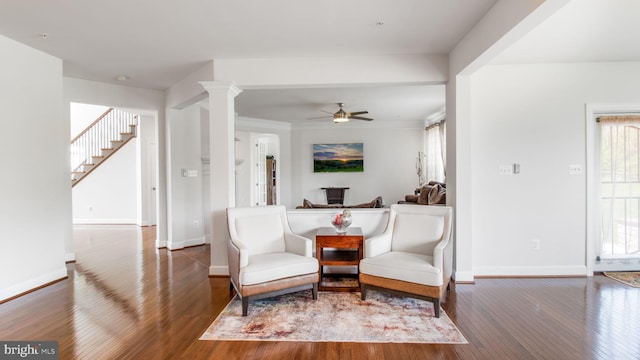 13002 Walkers Ln, Bowie, MD 20721 - living area with wood-type flooring, ornate columns, ceiling fan, and baseboards