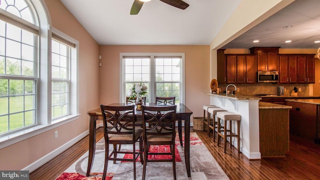 13002 Walkers Ln, Bowie, MD 20721 - dining room featuring dark wood-type flooring, baseboards, ceiling fan, and vaulted ceiling
