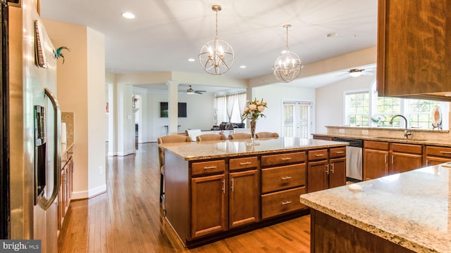 13002 Walkers Ln, Bowie, MD 20721 - kitchen with a sink, appliances with stainless steel finishes, ceiling fan with notable chandelier, and open floor plan