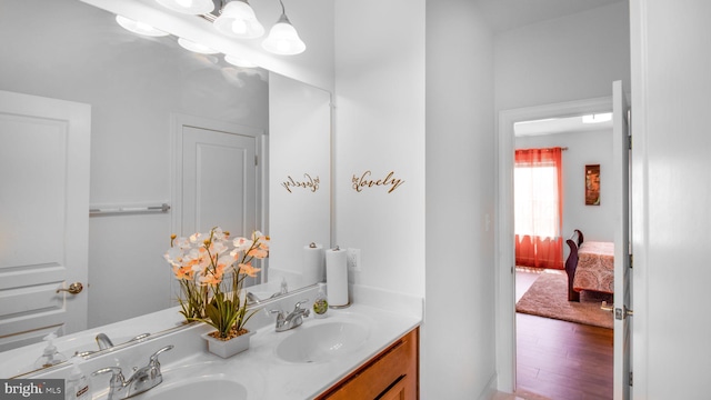 13002 Walkers Ln, Bowie, MD 20721 - ensuite bathroom featuring double vanity, a sink, ensuite bath, and wood finished floors