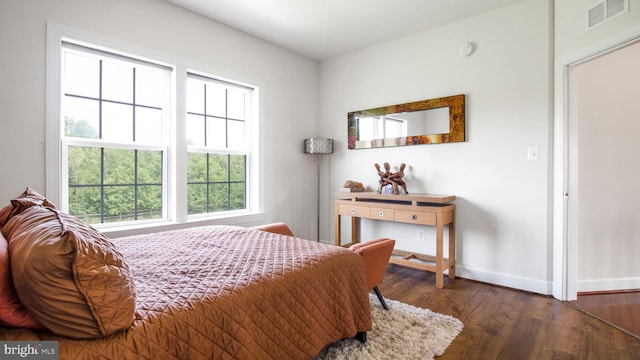 13002 Walkers Ln, Bowie, MD 20721 - bedroom with baseboards, visible vents, and wood finished floors