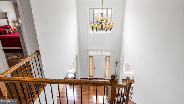 13002 Walkers Ln, Bowie, MD 20721 - foyer entrance featuring an inviting chandelier, wood finished floors, and a towering ceiling